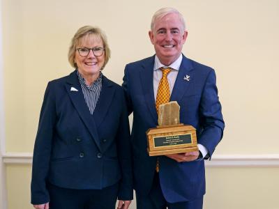 Robert Hardie, right, outgoing rector of the University of Virginia, is proud of winning the Samuel R. Crockett Award for supporting the relationship between UVA and UVA Wise. Donna Henry, chancellor of the University of Virginia’s College at Wise, presented the award at last week’s UVA Board of Visitors meeting. (Photo by Matt Riley, University Communications)